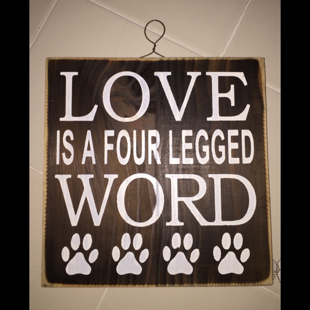 Animal plaque says: LOVE IS A FOUR LEGGED WORD.